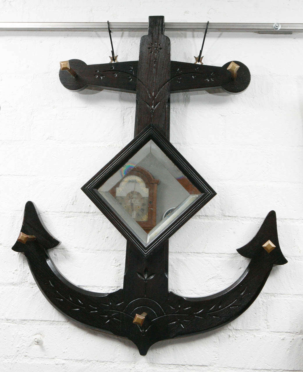 This unique piece of Eastlake decorative furniture is a great example of the Victorian age design movement attributed to the writings of the architect, Charles Eastlake. It was manufactured by the Clarke Bros.& co. The combination of the exquisite