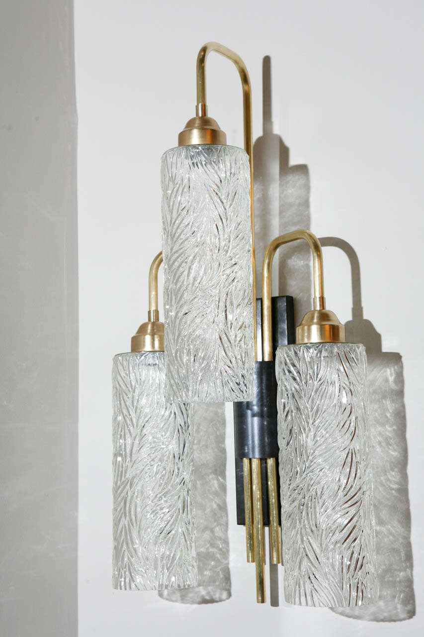 Large brass sconces with vintage German textured glass shades, there are four available, price per sconce.  Unlacquered brass (brass will continue to age naturally with time), oil rubbed bronze patina back plate (with aged finish, will continue to