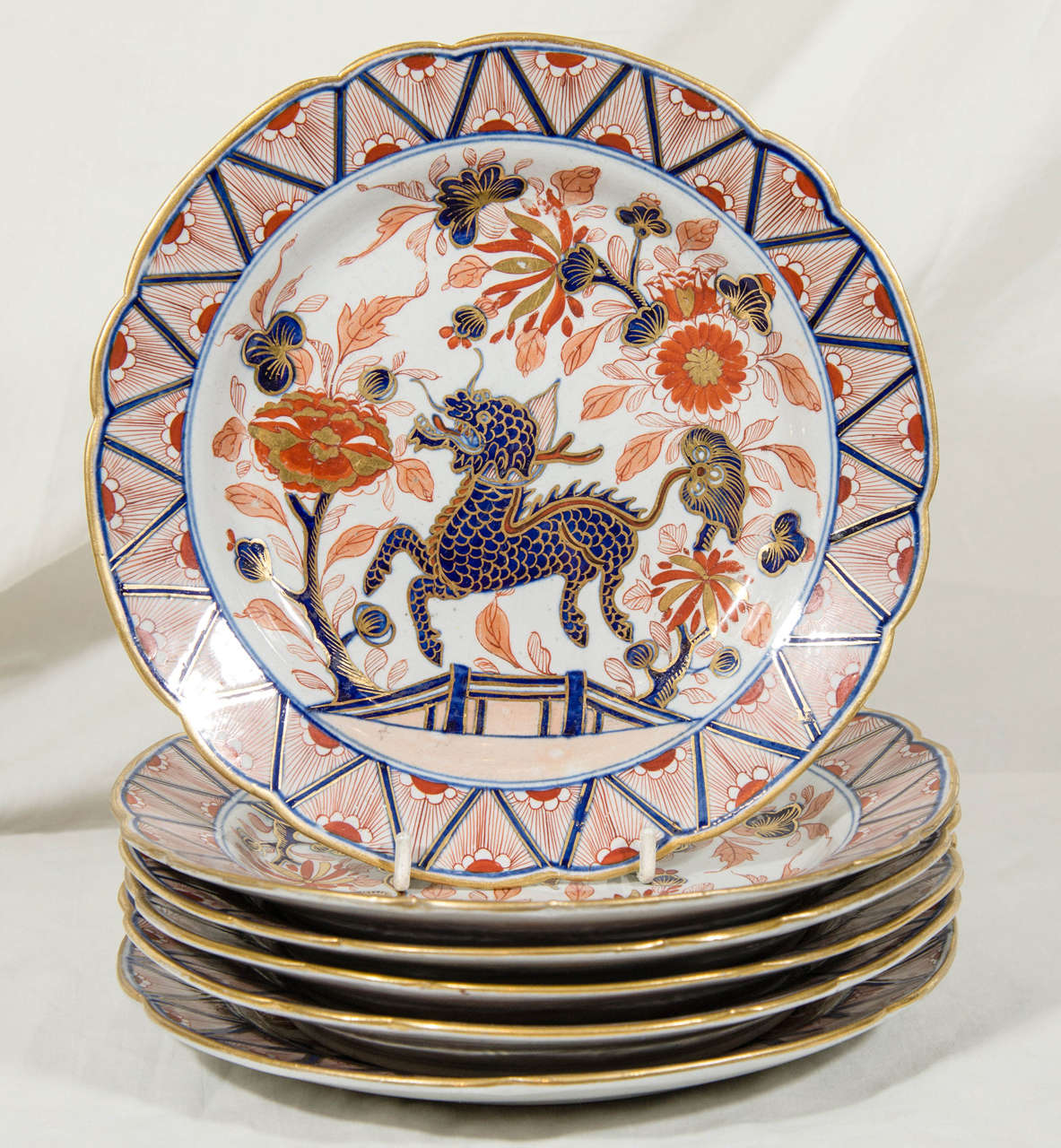 An Imari inspired pattern showing a dragon flying through a flowering garden.
Made by Turner, the inventor of ironstone*, the dishes are marked 