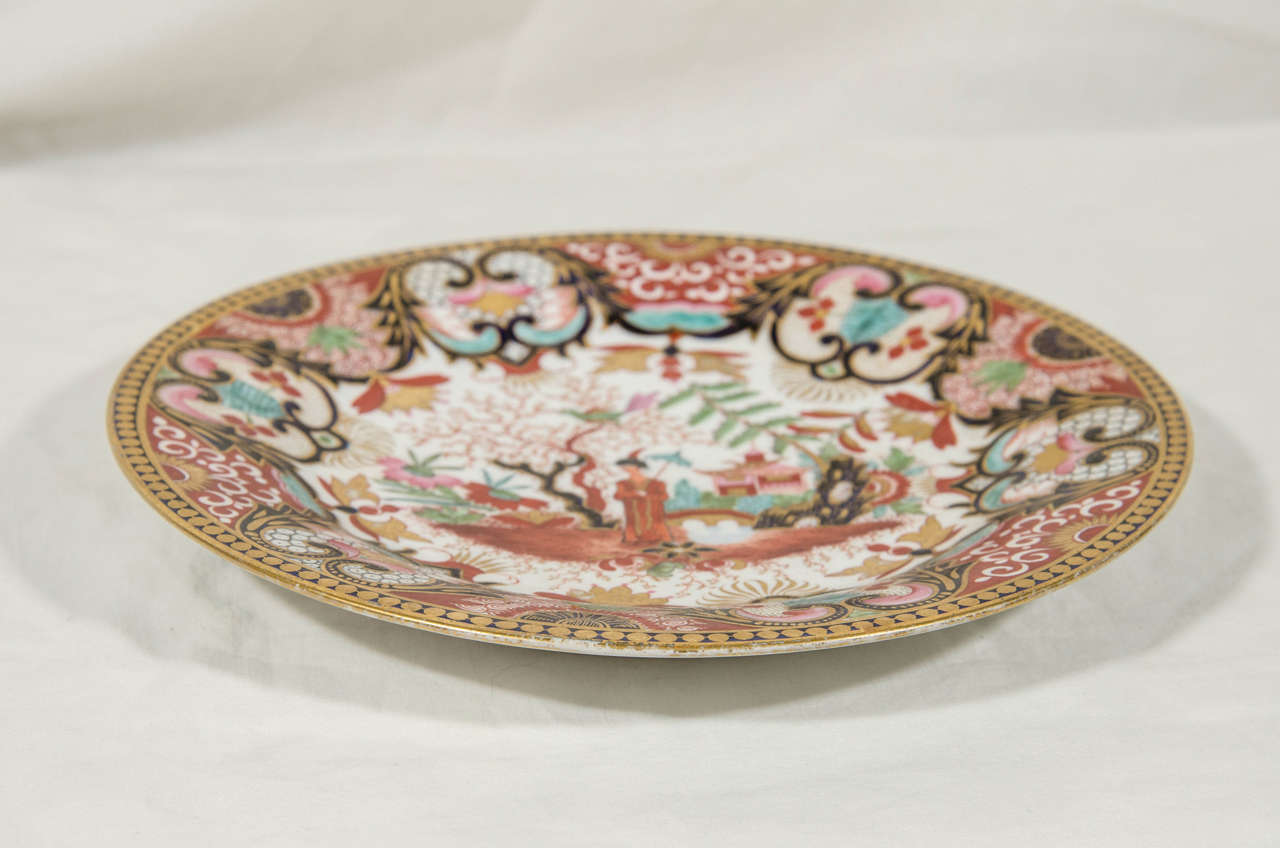 A pair of Flight Barr Barr Worcester dishes with an English chinoiserie scene.
A scholar stands in his garden, around him are the traditional scholar's rock and a flowering tree in which a longtailed bird seems ready for flight. Using Imari colors