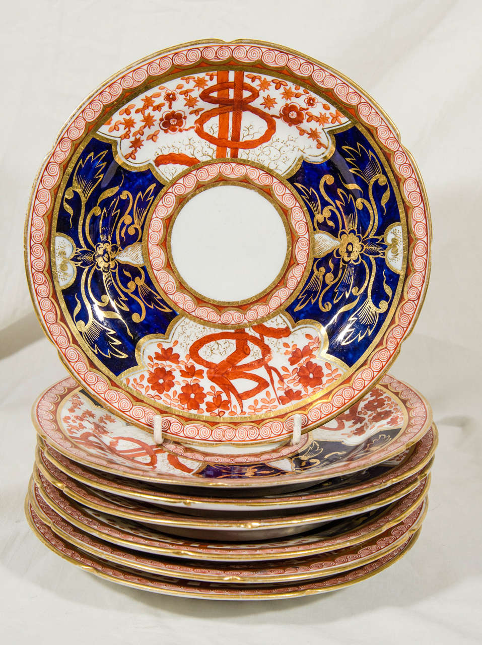 A group of a dozen Imari inspired dessert dishes in the 