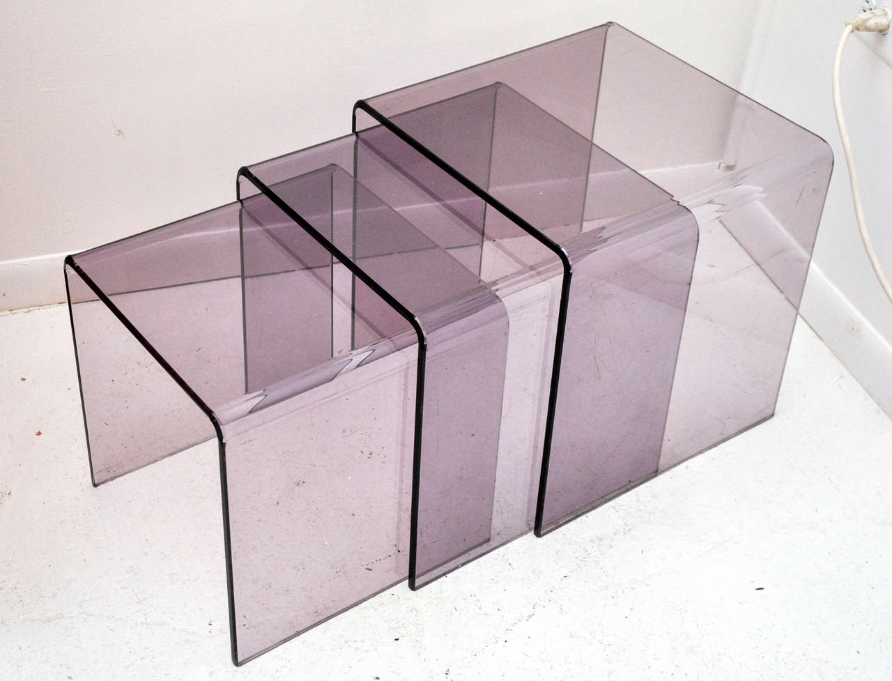 Beauty and function! Fabulous set of vintage lucite nesting tables in a gorgeous purple hue.