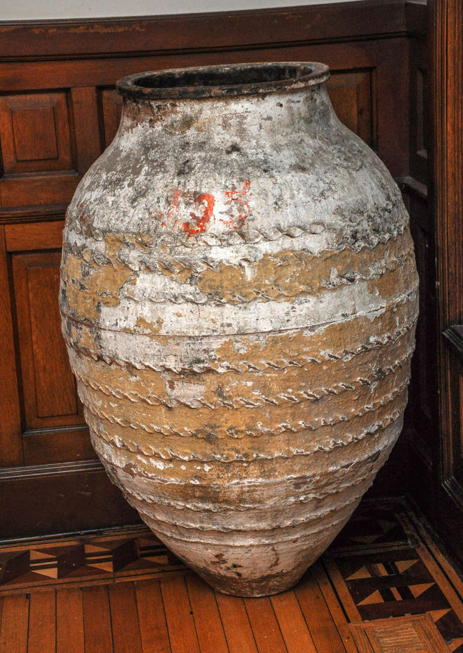 Antique French urn found in Provence. Unusual orange color fleck detail in one small space.