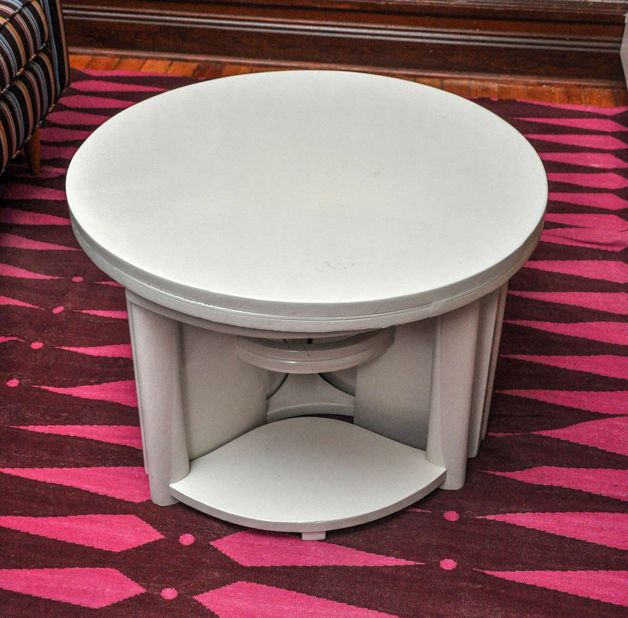 Dramatic presence and shape with unique trio of stools that can be stored inconspicuously underneath and used for extra seating