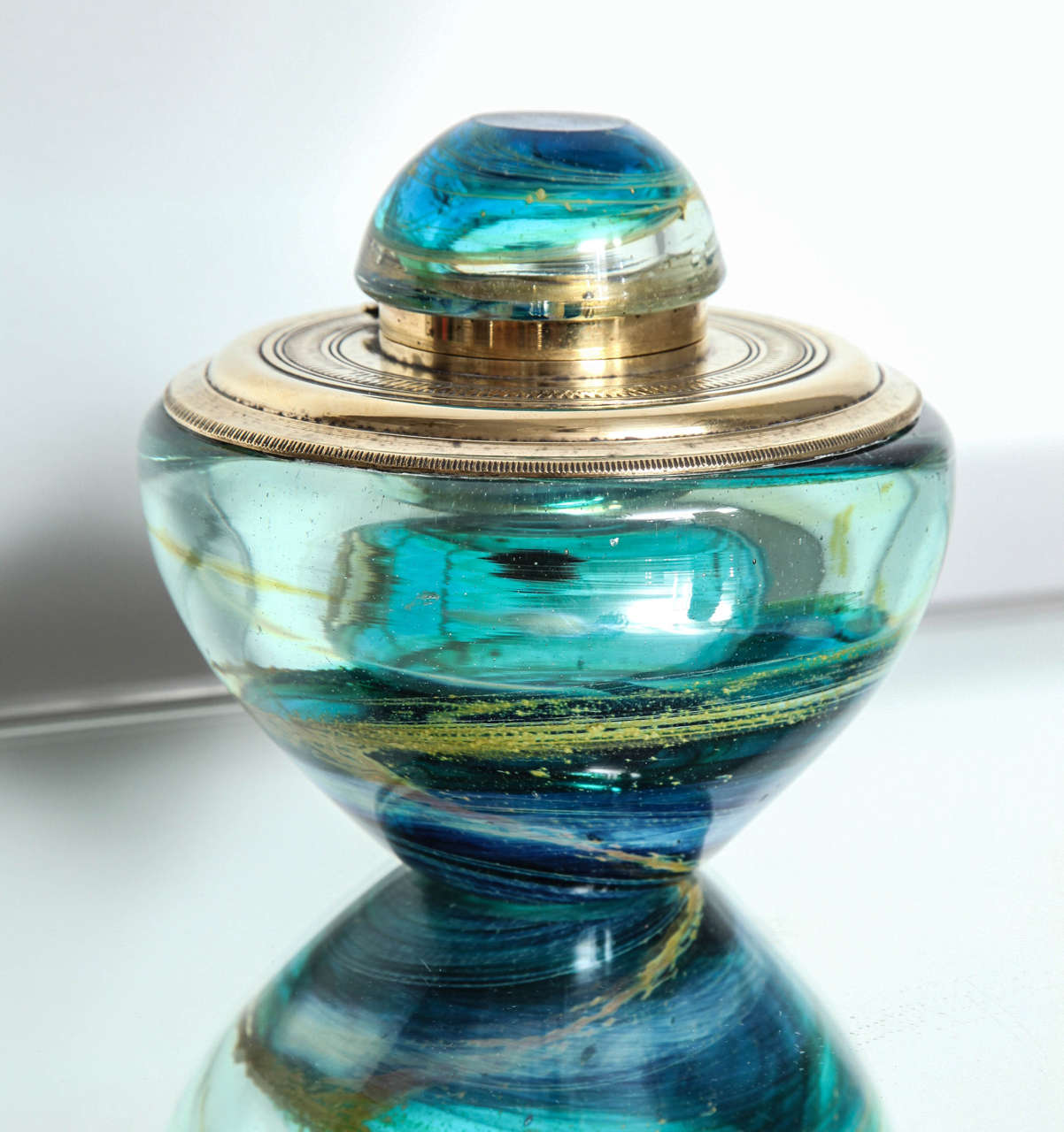 A wonderful thick Murano glass inkwell with blue swirl decoration and silver plated hinge and cap.