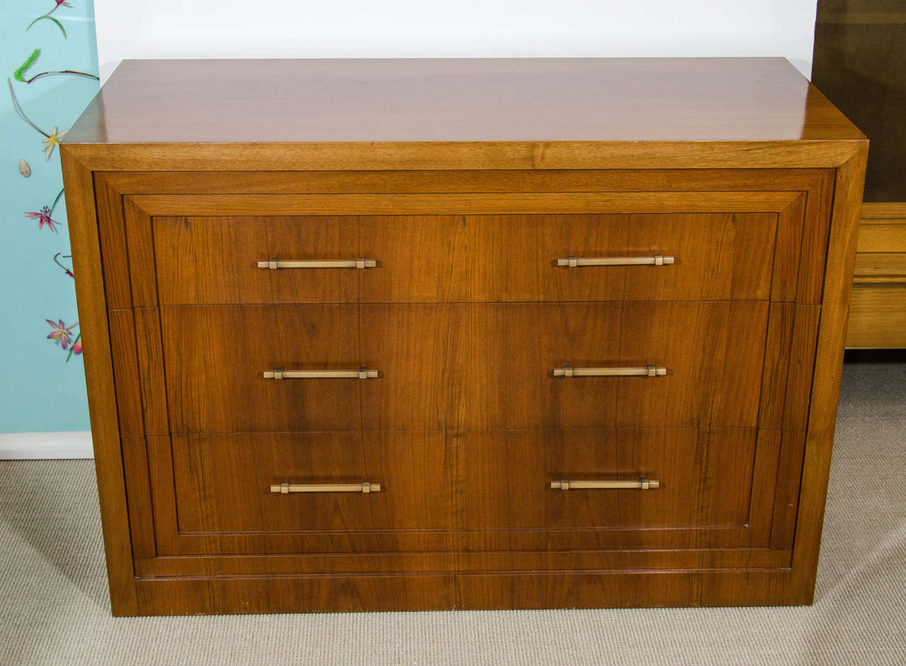 T. H. Robsjohn-Gibbings very rare commode of beautiful proportions for Saridis, 1963. The commode has a paper label on the back and is numbered and has an exact date. It also has an interior plaque signed T.H. Robsjohn-Gibbings, and Saridis. Walnut
