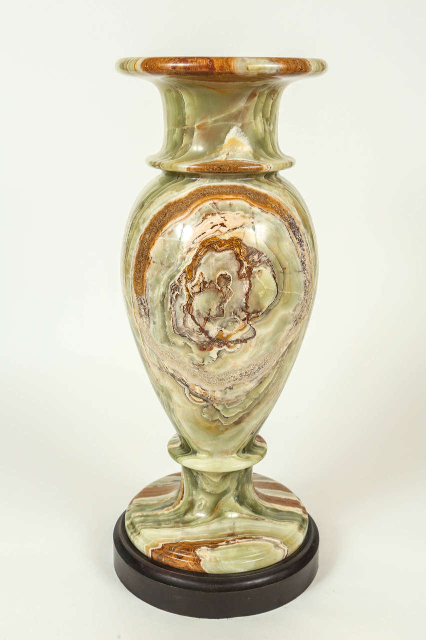 Marbled onyx floor urn on wood base. Made in Pakistan by Maitland-Smith.