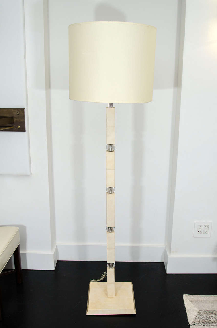 Parchment covered oak floor lamp by Jacques Adnet with spherical crystal accents.