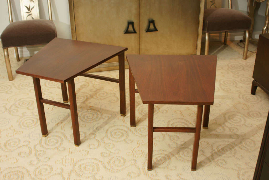 Beautiful pair of Trapezoid mahogany side tables by Edward Wormley for Dunbar. The tables are in Excellent condition as they have been restored to the original condition and each have they 