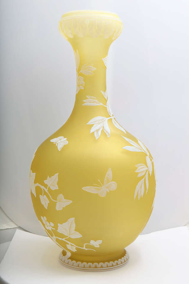 A fine signed Thomas Webb & Sons yellow and white cameo glass vase carved in a floral pattern