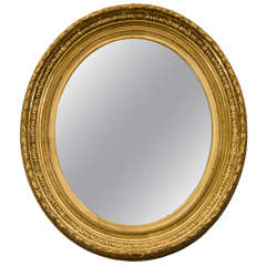 A French Louis XVI Style Giltwood Oval Mirror