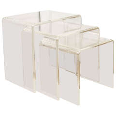 A Set of Three Lucite Nesting Tables