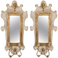 A Pair of Painted and Parcel Gilt Sconces