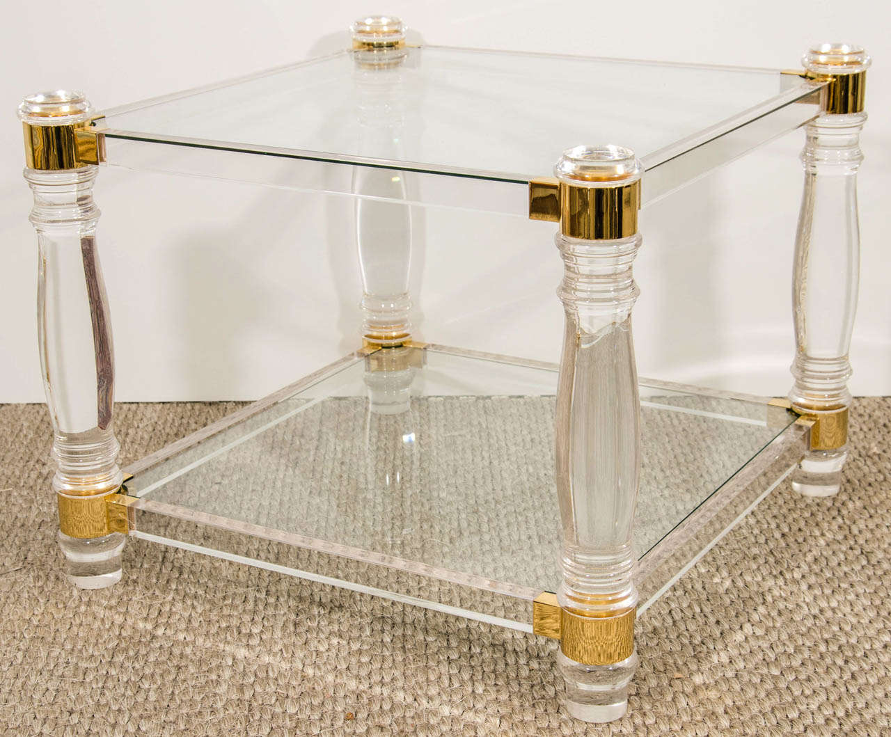 A very striking pair of tables that combine tradtional design elements (turned legs) and modern materials (lucite and glass).  This duo can go anywhere.