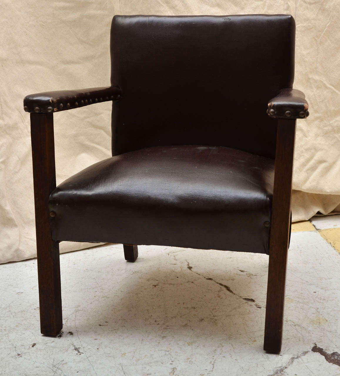 English Handmade Early 20Th Cent. Platform Armchair Covered in Naugahyde With Nailheads. Legs & Arm Supports Made From Hand Hewn Mahogany. Great As Decorative Piece