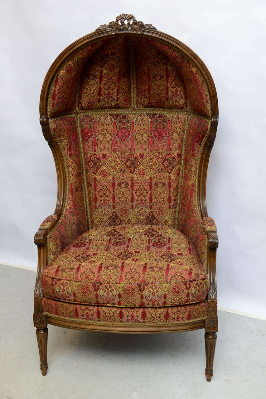 Striking and elegant traditional French hooded chair.