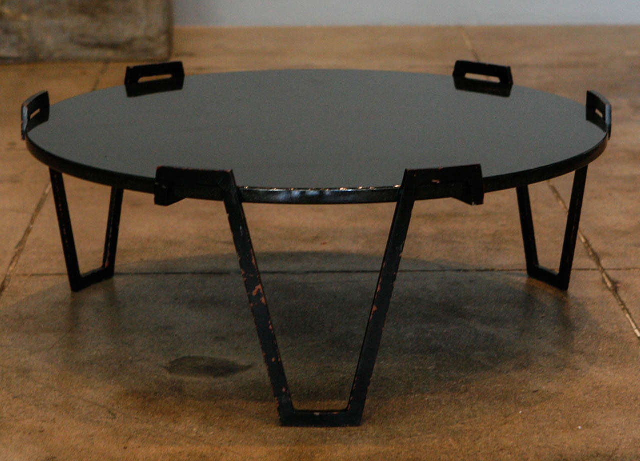 A coffee table by french designer Jean Royere.