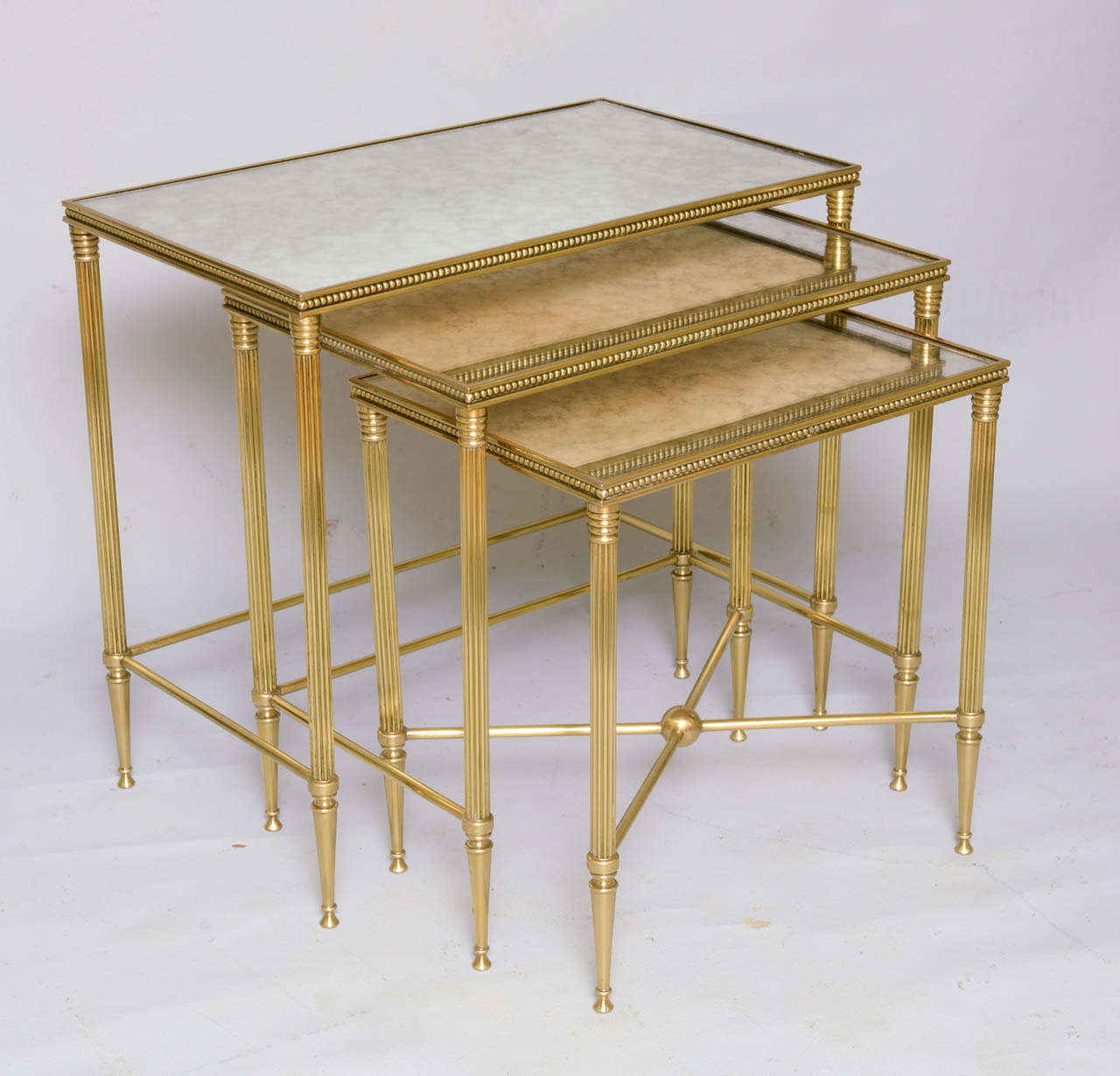 Jansen Style Nest of Brass Stack Tables with Mirrored Tops