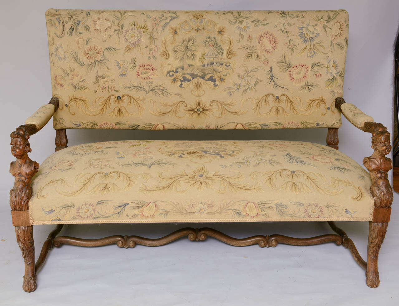 Carved Early 19th Century Walnut Settee with Carved Figural Details