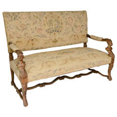 Carved Early 19th Century Walnut Settee with Carved Figural Details