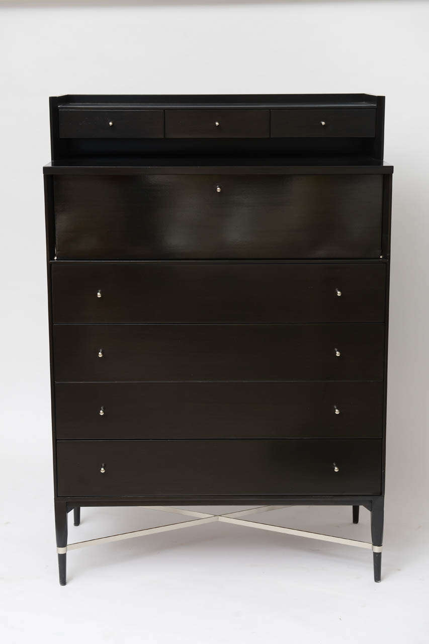We find this tall dresser by Paul McCobb for Calvin so smart, with its ebonised finish and polished nickel hardware.