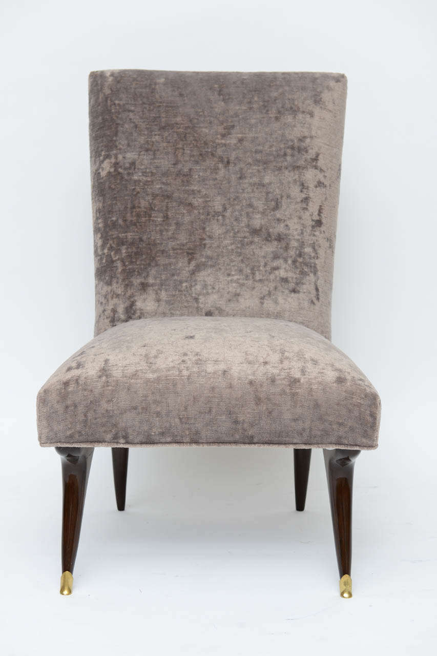 Low and lovely Italian modernist slipper chairs are perfect for a ladies dressing room or pulled up to a coffee table as an oh-so-chic alternative to ottomans. We've upholstered them in a moody taupe-grey velvet with just a hint of eggplant. High