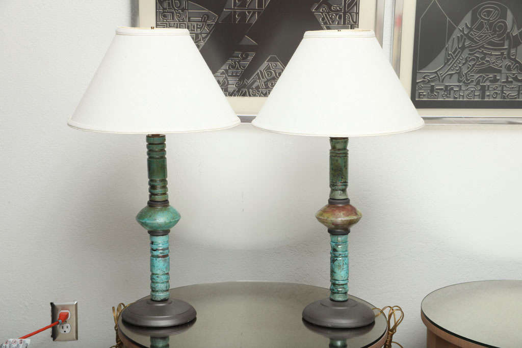 Combining gorgeous color and quality hand-craftsmanship, this rich turquoise-glazed non-matched pair of Raku pottery lamps dazzle! (Shades not included.)