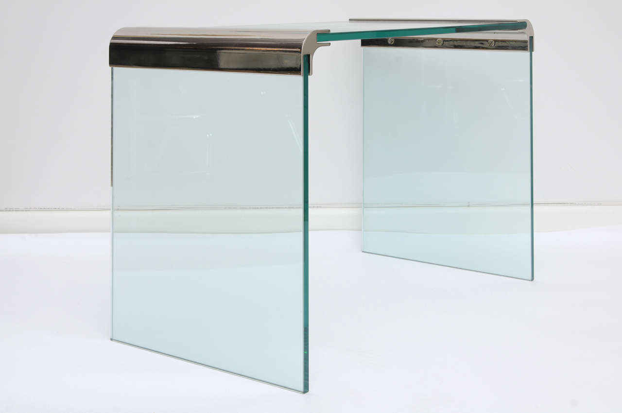 Clean lines, airy, and chic; these side tables both disappear and function all at once. The half inch glass panels are supported by the polished steel waterfall corners.