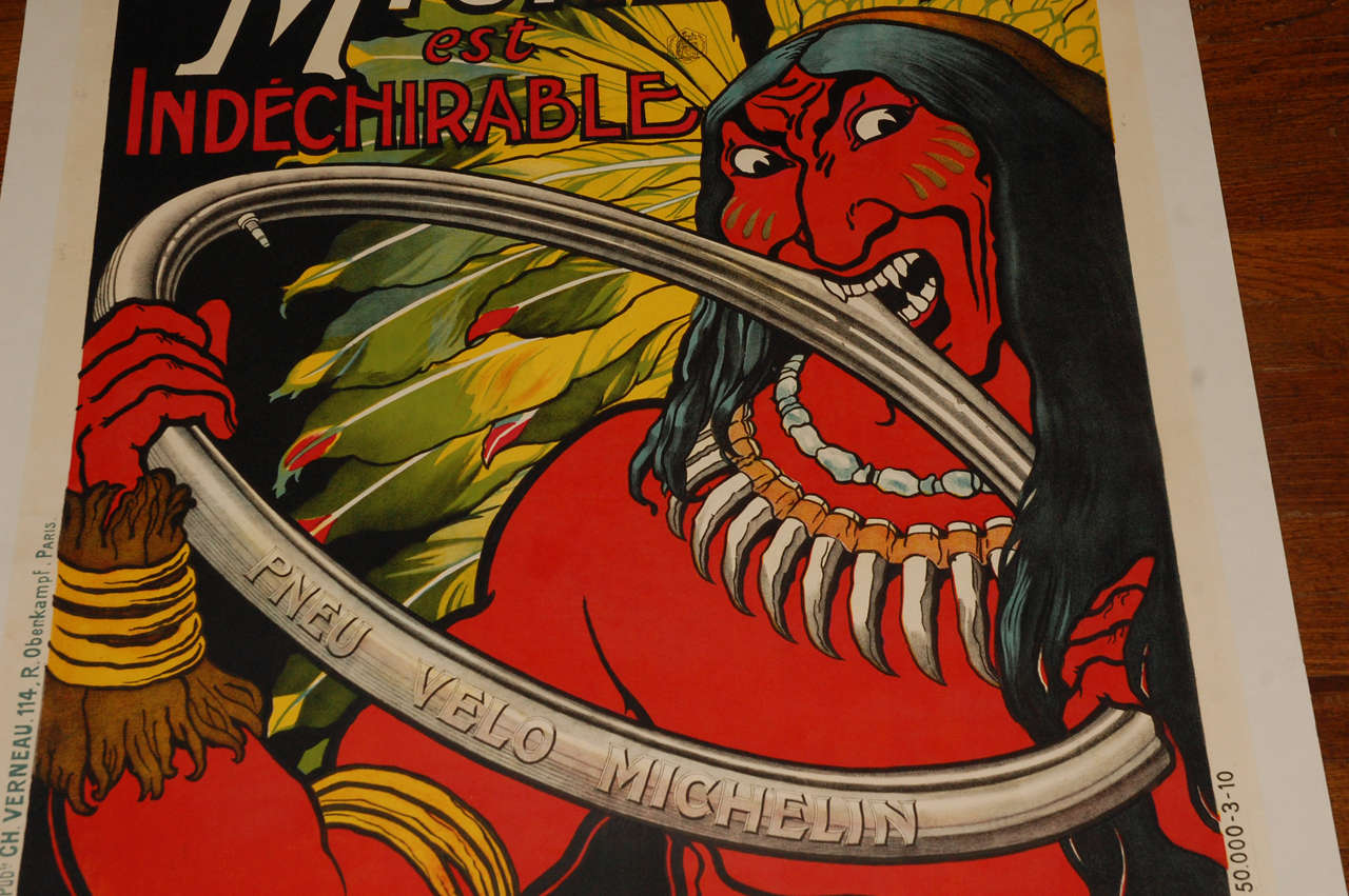 Offering a very cool original 1910 French Michelin tire poster. Imagery shows a tough Indian trying to bite into a Michelin bicycle tire. This is a rare piece, and the colors are vibrant as it has been in storage for over 20 years.