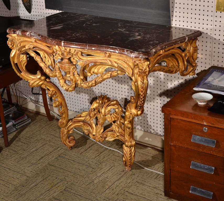 Wood carved gold leaf with original French marble top wall console.