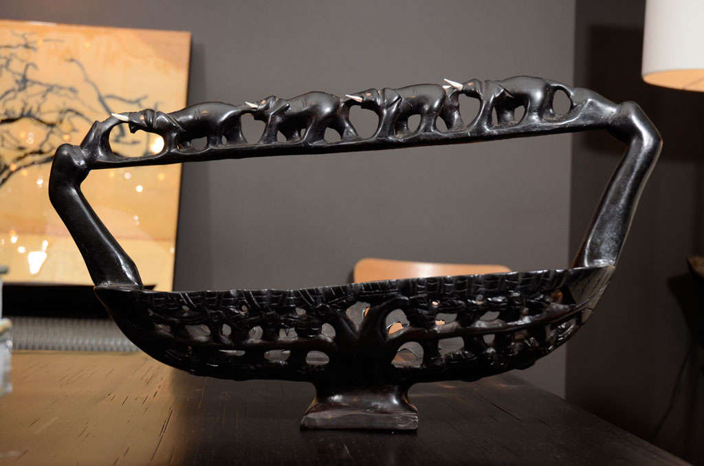 Intricately hand carved ebony wood basket with carved bone detail.