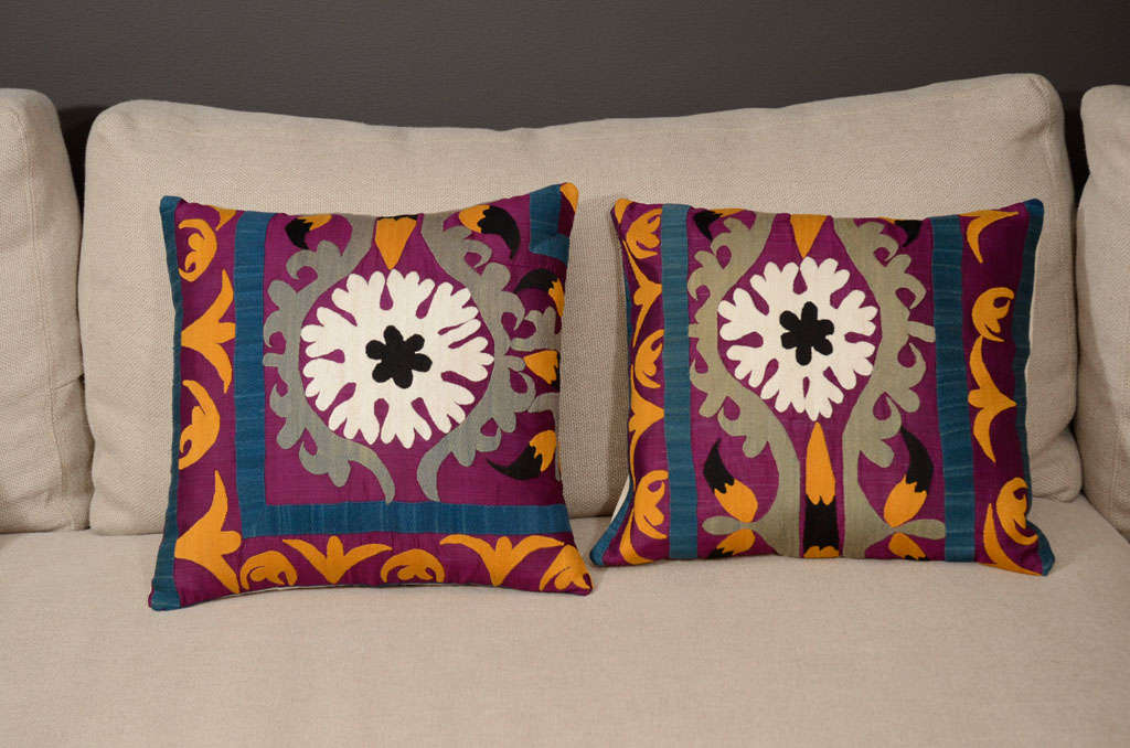 Unique collection of vibrant, handmade pillows. Textile panels embroidered with silk thread and linen backs.