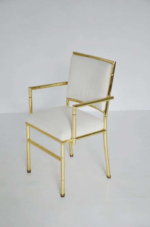 Brass framed dining chairs.  70's glam faux bamboo.  Will be upholstered in COM.

4 chairs available.  Price per chair.
