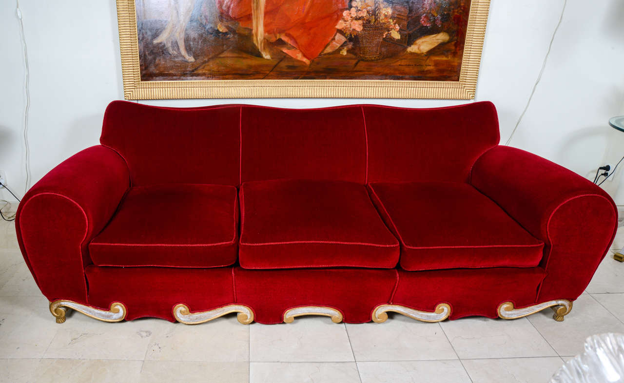 Rare set of two armchairs and one three places sofa from the 1940s.
Attributed to Jean Pascaud.
White cerused oak with gold patina on the legs.
Theater painted red velvet.