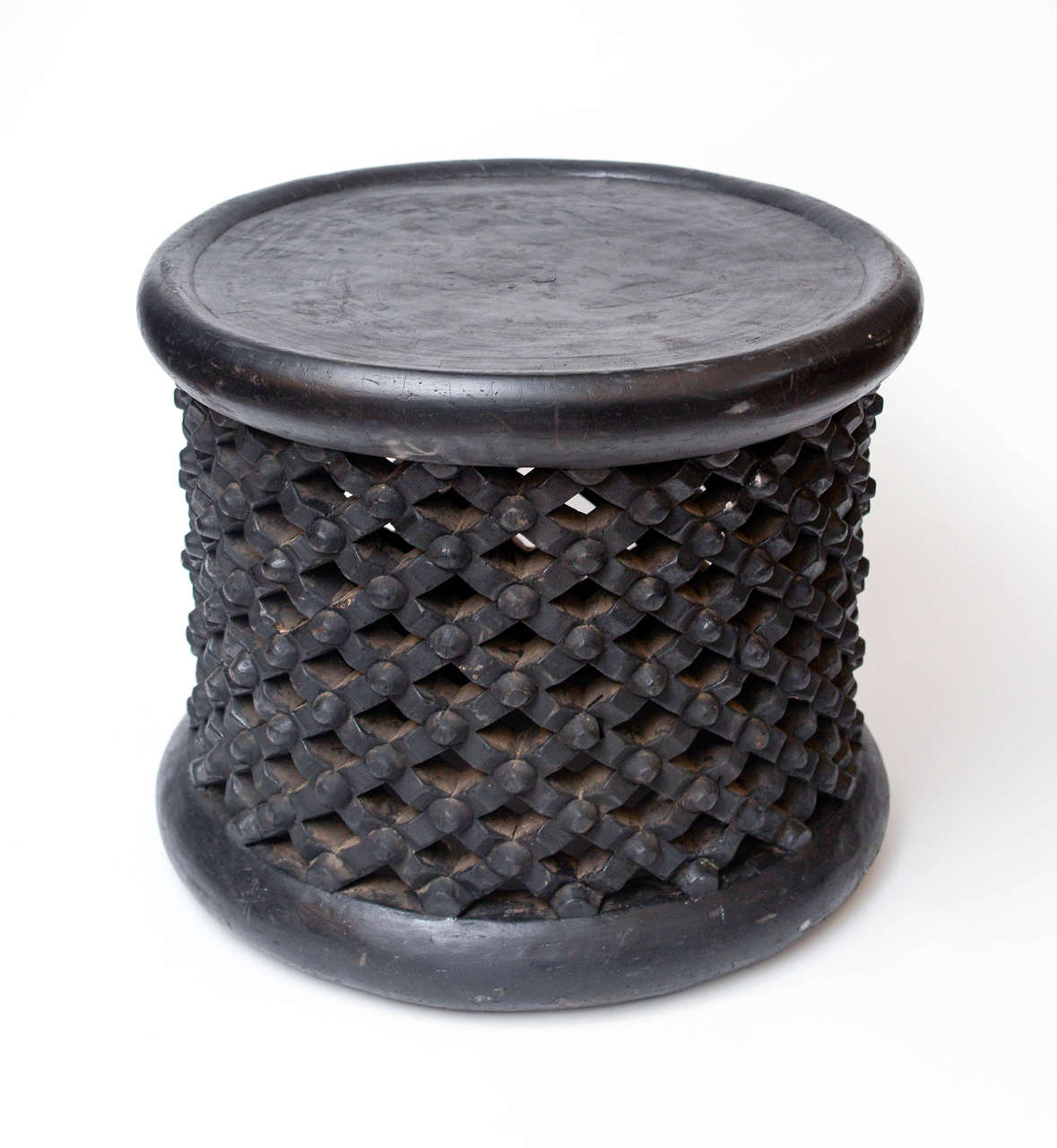 Small black African round table or stool.