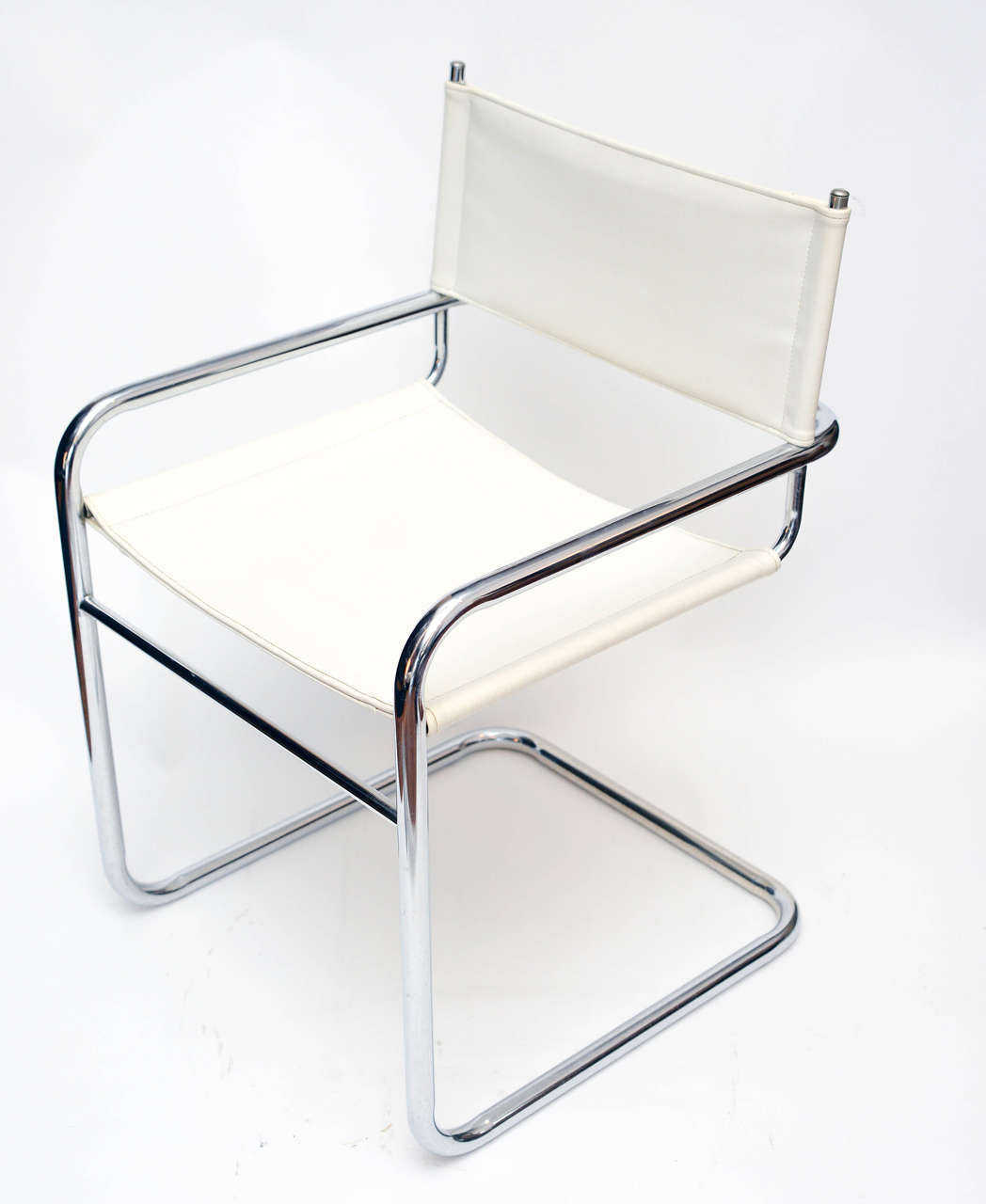 Set of four midcentury chrome and pleather chairs. 
The chrome and white pleather are original and in very good condition for the age. Comfortable and well priced!

 