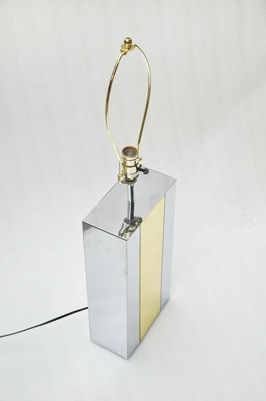 Vintage chrome and brass modernist table lamp with one socket.