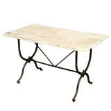 Marble and wrought iron garden table
