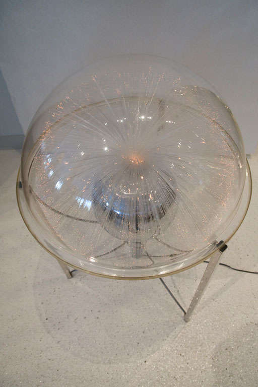 This fun and amazing fiber optic globe from the 1970's is constructed of chrome metal and acrylic designed by Fantasia Lighting.  Thousands of optical fiber tips come alive with changing color and motion creating a beautiful ambience.  It's like