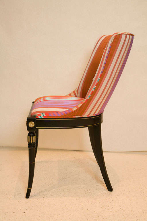 A striking pair of Hollywood Regency side chairs newly upholstered in a beautiful striped silk with button details.