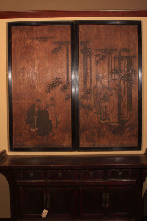 A pair of Japanese sugi-do painted cryptomeria wood doors. The doors with large painted floating panels within a black lacquer sugi (cryptomeria) wood frame. The surface left in its natural state and painted with gesso (Gofun) and mineral paints.