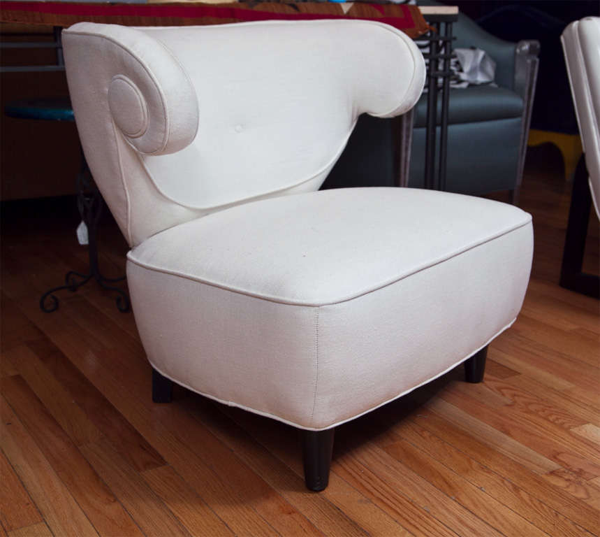 Special pull up chair without arms.  Scroll wings and button back.  Recovered in muslin.  Plack wood legs.