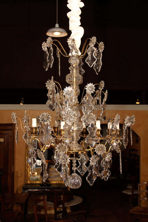 French 18th Century Crystal Chandelier

This is one of the earlest and highest quality chandeliers we have seen in many years. It features the old soft hand-cut bronze arms. If you look closely the bronze is screwed on, not welded. The hand-cut