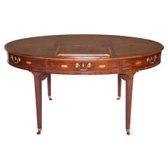 Antique A fine George III mahogany oval library table.