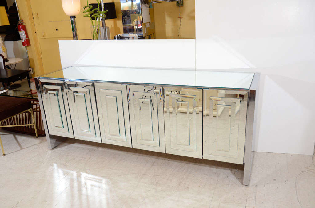 Fabulous mirrored credenza dresser by Ello!  Beveled Mirrors on the doors, mirrored surface on the top, chrome panels on the sides. The piece we currently have has the same exterior appearance, but a different interior configuration with drawers.