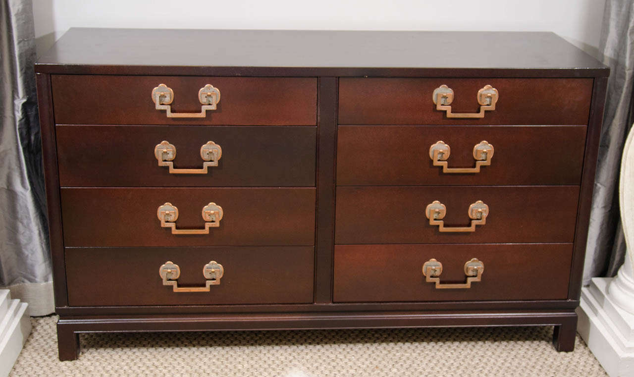 A handsome eight-drawer dresser made by Landstrom with beautiful hardware made of Greek key motif over quatrefoil design.