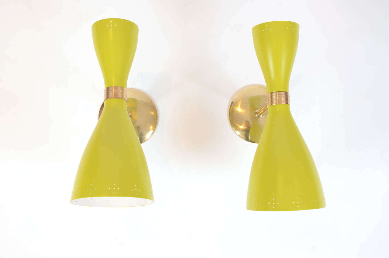 Pair of French lacquered metal and brass articulated wall sconces.