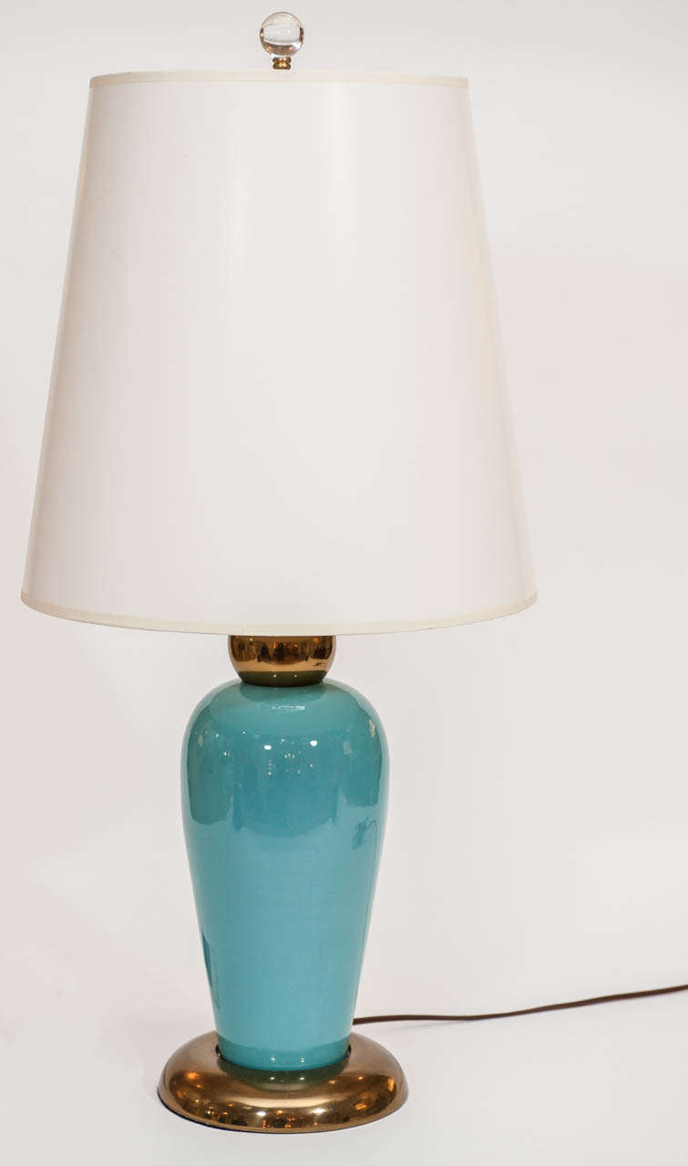 An aqua colored pair of table lamps with a warm brass base and top.  Decorative, sophisticated and fun!  Rewired. Shades optional.