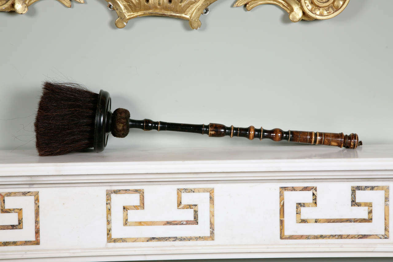 The circular brush head fashioned from horn

England circa 1680