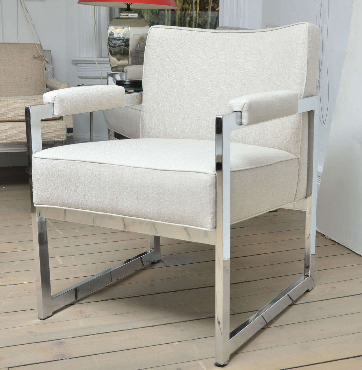 Pair of upholstered linen chromed steel armchairs.